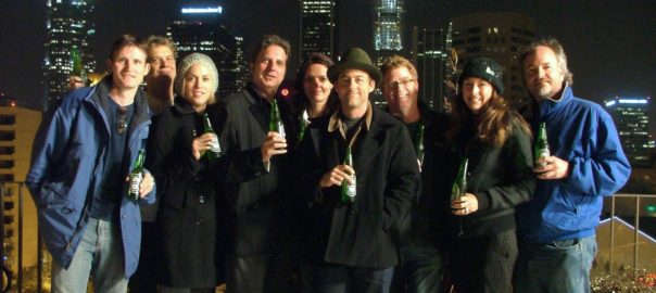 nighttime rooftop party with downtown Los Angeles in background
